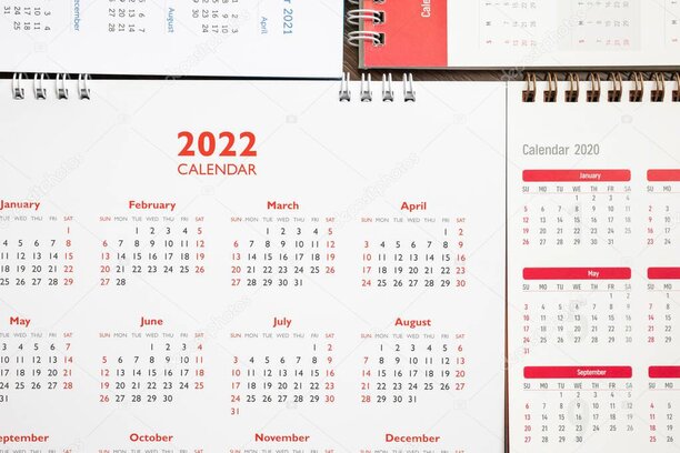 Senior looking at a calendar to avoid Medicare late enrollment penalties.