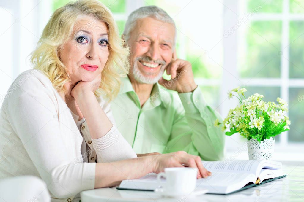 Senior couple reviewing Medicare plan documents with an advisor.
