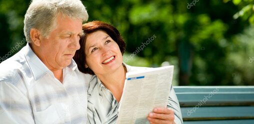 Senior couple reviewing Medicare information with an advisor.